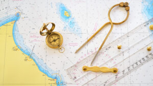 Ships can be navigated around the world with just a map, compass, and dividers. (Source: Shutterstock)
